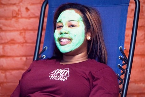 A student gets a facial during relaxation night for finals week.