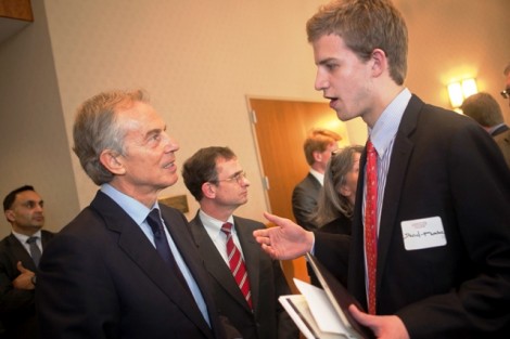 Tony Blair speaks with a student.