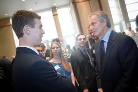 Tony Blair speaks with a student.