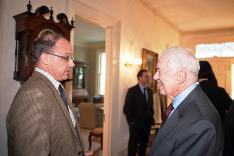 Paul Barclay, associate professor of history, speaks with President Jimmy Carter.