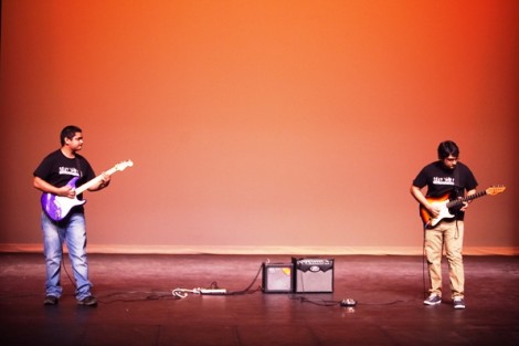 Rijan Maharjan '14, left, and Sabbir Siddiqui '13 perform on electric guitars.