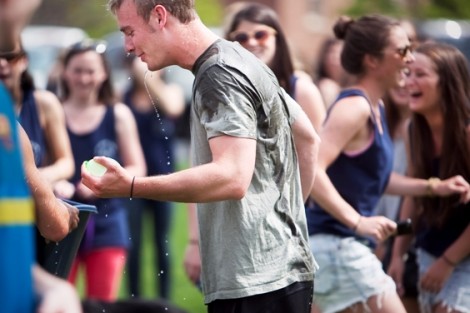 A student gets all wet during the balloon toss. 