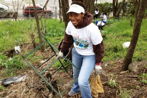 Lorre-Ann Fisher ’12 helped clean up the Roberto Clemente Community Garden for New York Cares Day.