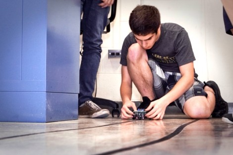 Dan Bolognini ’16 places his robot on the race track.