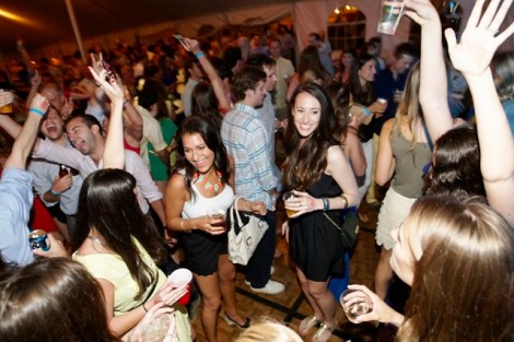 Alumni dance the night away to the music of UUU in a huge tent set up on the Quad.