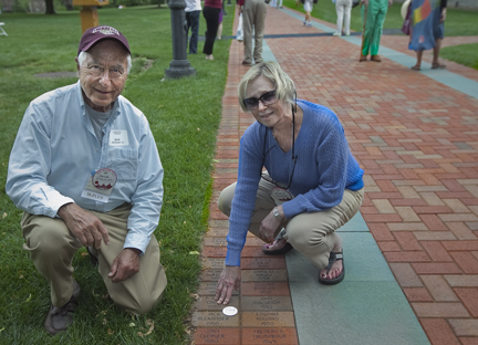 Jack Alexander '50 and friend Sheila Schleier locate the brick etched with his name.