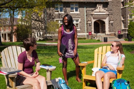 Emily Bennett 16, Brandi Porter '13, and Liza Fryman '16 relax on the adirondack chairs on the Quad.