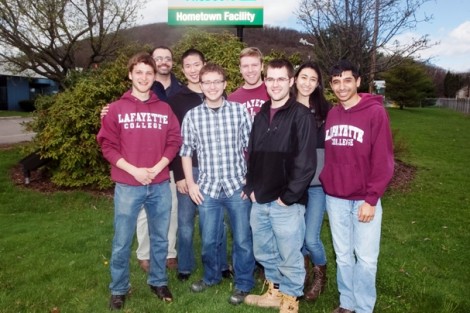Students pose by the sign at the Air Products facility in Hometown, Pa. 
