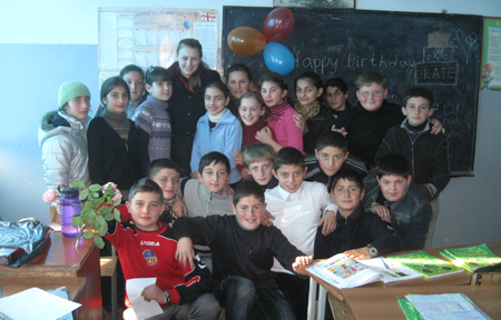 Caitlin Lowery ’10 celebrates her birthday with the 6th grade students in her class at the school in Dimi, Georgia.