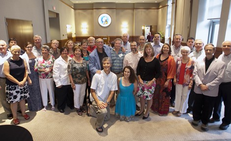 2013 Alumni Summer College attendees, faculty who taught the courses, and President Alison Byerly gather in Wilson Room, Pfenning Alumni Center.