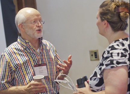 Ed Auble '61 talks with Prof. Myers after class.