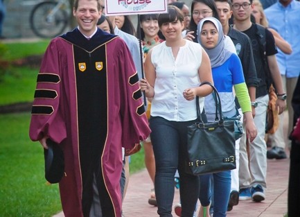 Paul McLoughlin, dean of students, leads the student procession. 