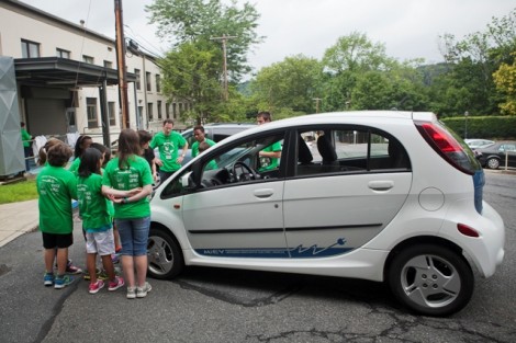 During the Moving Down the Road segment of the camp, Carolyn Buckley, lab coordinator in psychology, shows the class her electric car. The students then created their own model electric cars.
