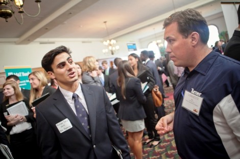 Mechanical engineering major Michael D’Olio ’14 discusses the job market with Bill Faust ’02 of Turner Construction. 