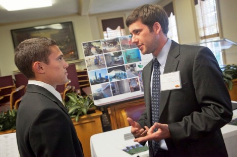 Gregory Dietz ’13, right, of Hydroenvironmental Solutions speaks with students.