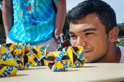 Luis Aviles '17 looks at the origami artwork.