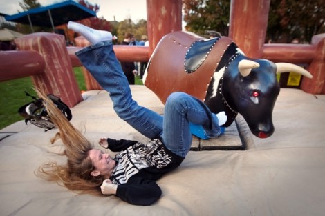 Rachel Paisner '17 gets a lesson on gravity from the mechanical bull.