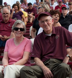 Harry Irwin '62 and wife Judy Irwin enjoy the game.