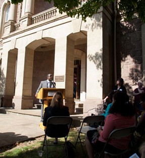 Robert Young '14 speaks in front of Pardee Hall at the opening of the exhibit.