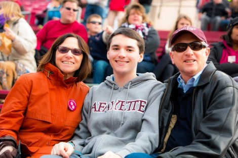 Andrew Eickemeyer '17 enjoys the game with his parents, Penny and John.