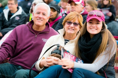 Jenna Orlando '17 at the football game with her parents, Anthony and Kathy