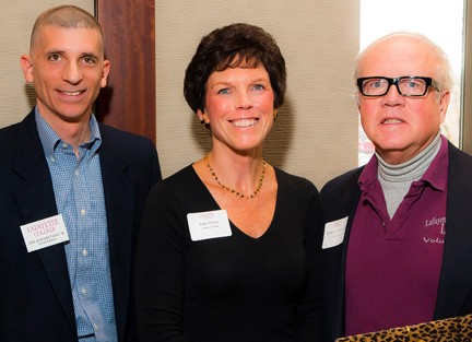 Robert Burns '63 (far right) receives the Ernest G. Smith Award from Joe Samaritano '91 and Julie Nolan.