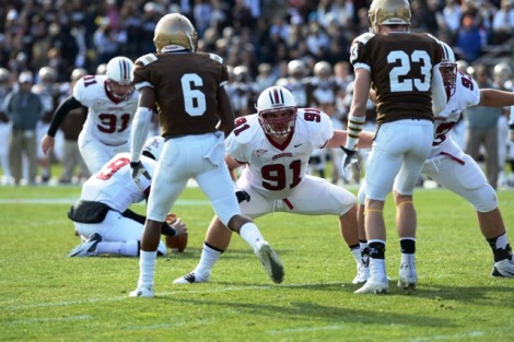 Defensive end Jake McTighe ’14 blocks Lehigh defenders during a field goal attempt. 