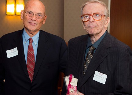 John Gilbert '55 (right) receives Hughes Correspondent Award from David Reif '68, Alumni Association president.