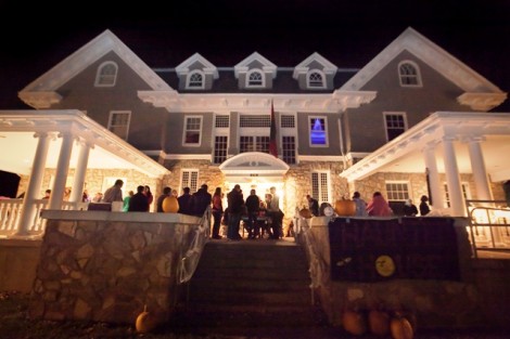 Students enjoy refreshments on the Phi Kappa Psi porch following the haunted house. 