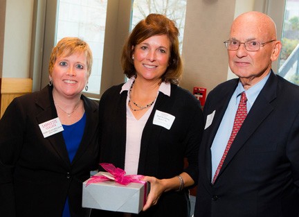 Barbara Strasburg Tucker '84 (center) receives Woodring Service Award from Rachel Nelson Moeller '88 and David Reif '68.