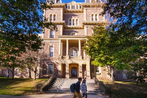 Students walk past the entrance of Pardee Hall.