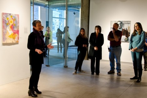 Michiko Okaya, director of Lafayette Art Galleries, welcomes visitors during the exhibit reception. 