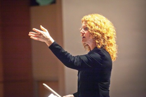 Jennifer Kelly, associate professor of music and director of choral activities, instructs the combined choirs. 