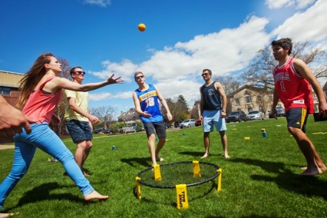 Students play spike ball. 