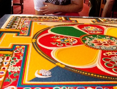 Daniel Jureller ’16 takes a closer look at the mandala.