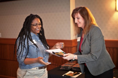 Ciera Eaddy ’14 receives her senior gift from Kim Spang, acting vice president of development and College relations.
