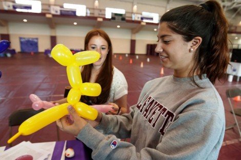 Students make balloon animals. 