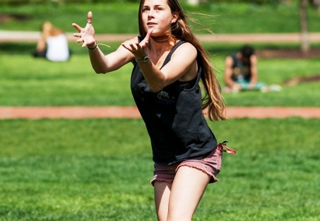 Maggie Noonan ’17 catches a football on the Quad.