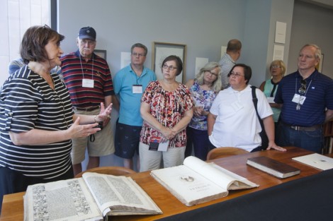 Diane Shaw (far left), College archivist, displays unusual and unexpected items from the Special Collections and College Archives of Skillman Library.