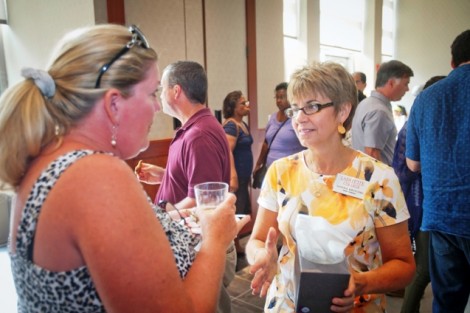 Donna Krivoski, director of parent relations, meets with parents during the reception in Pfenning Alumni Center.