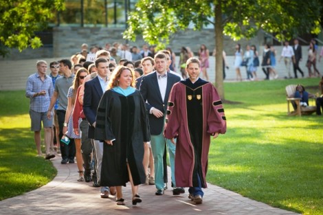 The student procession is led by Erica D'Agostino ’95, dean of advising and co-curricular programs, and Paul McLoughlin, dean of students.