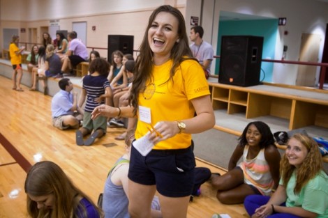 Orientation leader Emily Mulford  ’15 shares a laugh with some new students.