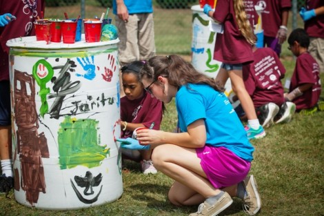 Students decorate compost bins at Metzger Fields.