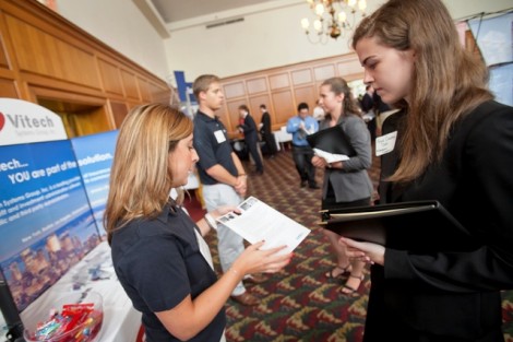 Paige Crowley ’15 speaks with a representative from Vitech.