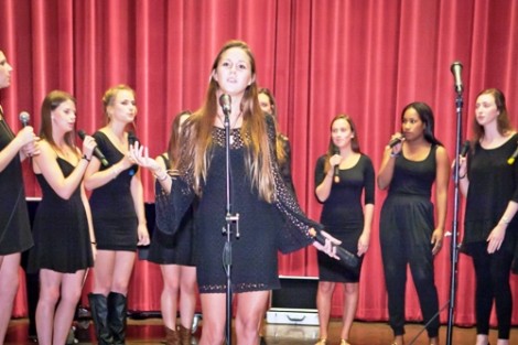 The female a cappella group Cadence sings for parents and families.