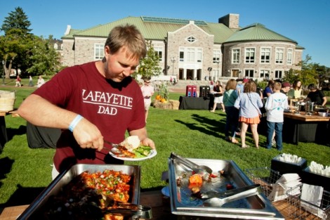 A Lafayette dad gets some food during the Family Tailgate on the Quad.