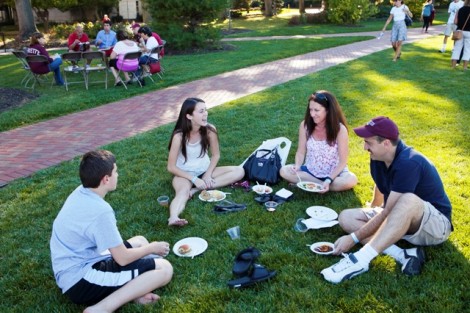 Families relax on the Quad.