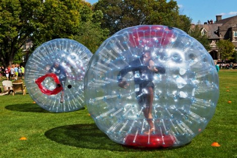 Students race through a bubble ball obstacle course.