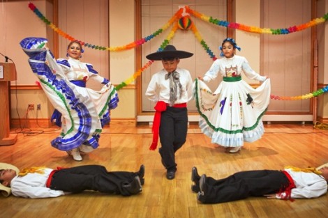 Members of the Xochi Quetzal dance troupe perform.
