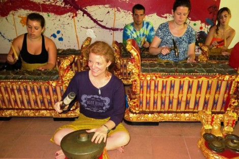 Katie Zeikel '15, l-r, Professor Jennifer Kelly, Derek Vill '14, Professor Mary Jo Lodge, and Savannah Sargent '13 try out their musical  skills in a gamelan ensemble during an interim course focusing on the arts in Bali.